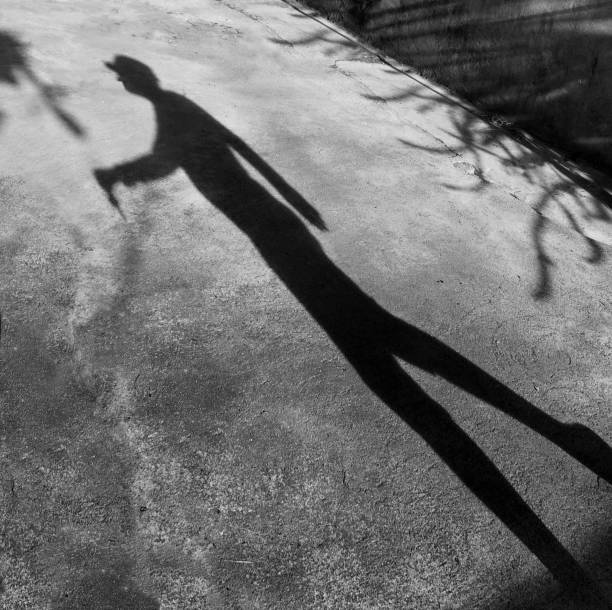 istock Man's shadow on the cement floor, concept for background. 657293002