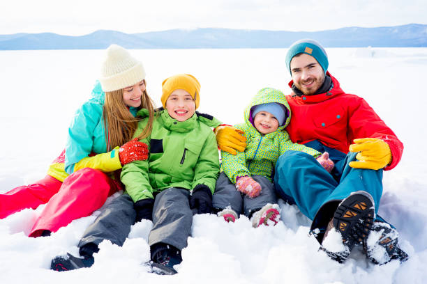 istock Family lying in snow 657293010