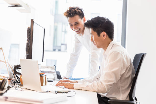 istock Having Fun Young Entrepreneurs working on Business Presentation 657293104