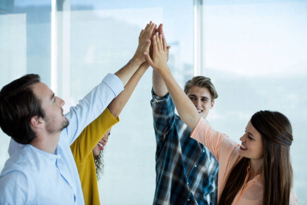 istock Creative business team giving a high five to each other 657296224