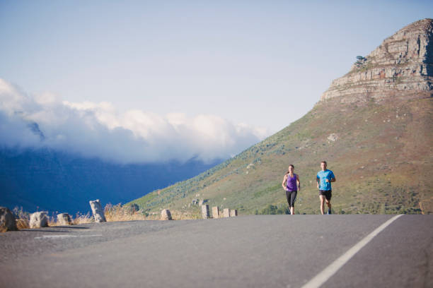istock Two friends enjoy a casual run together 657299140