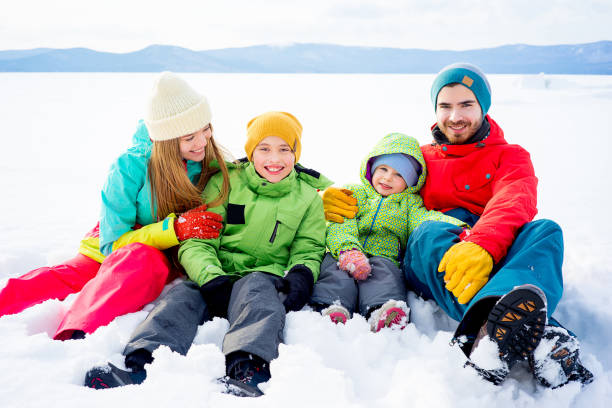 istock Family lying in snow 657304180