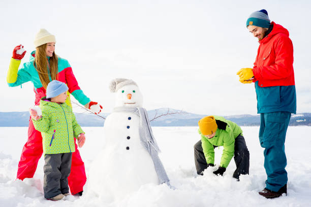 istock Family playing snowballs 657307046