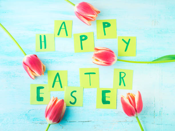istock Happy Easter background tulips flowers hand written letters 657317786
