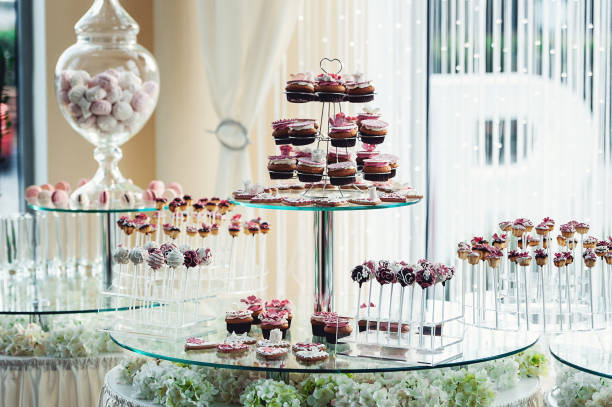 istock Cute candy bar with various candies and cakes. Wedding candybar 657318018