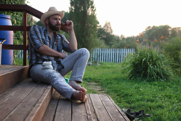 istock man smoke pipe outdoor 657324044