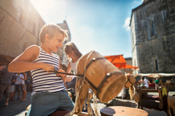 Kids tourists sightseeing beautiful Italian town of Volterra in Tuscany. \n\n\n