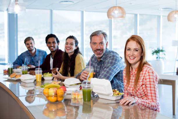 istock Creative business team having meal in office 657330860