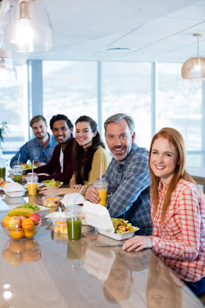 istock Creative business team having meal in office 657331424