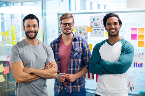 istock Creative business team standing against the wall with sticky notes 657333058