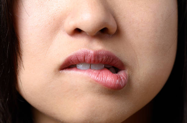 istock Thoughtful woman biting her lip 657339462