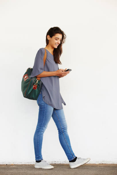 istock Beautiful young woman using mobile phone 657350816