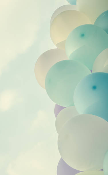 istock pink balloons background over pastel cloud 657351758