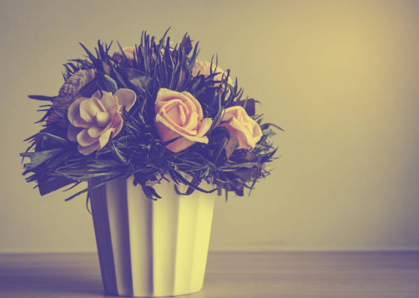 vintage flower in flower pot process in vintage tone