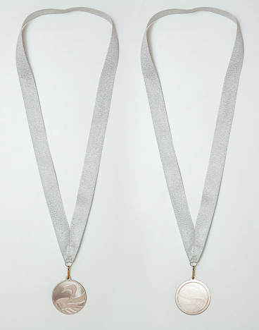 Silver medal with ribbon, two sides, isolated on a white background