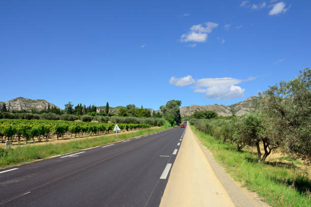 French countryside landscape. Road to foothill of Alpe mountain, Provence, France French countryside landscape. Road to foothill of Alpe mountain, Provence, France foothills parkway photos stock pictures, royalty-free photos & images