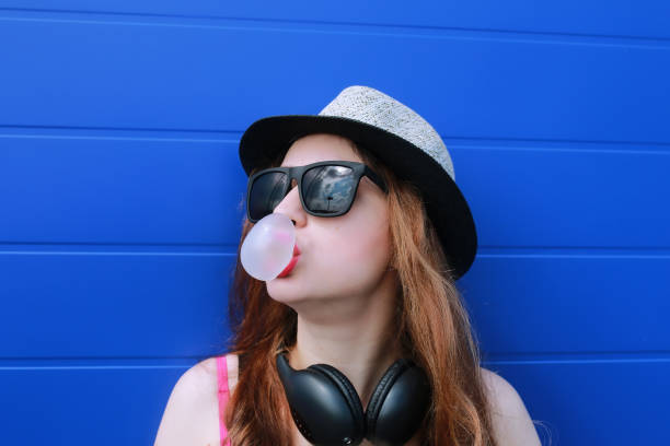 istock hipster girl at the blue wall 657360342