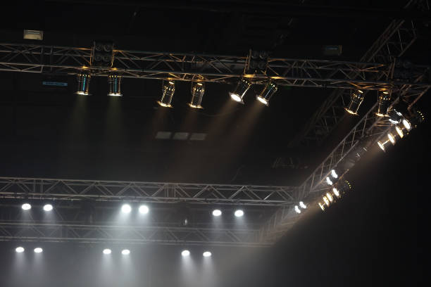 istock Lights beams Spotlight ray moving lighting on rack construction from corner to see only light 657360572