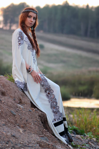 istock woman in white dress sunset 657361124