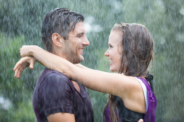 istock Romantic couple in summer rain 657361344