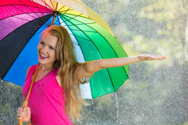 istock Woman holding colorful umbrella 657361356