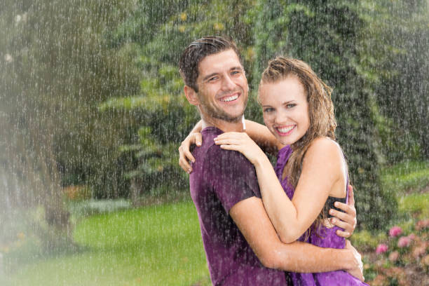 istock Man and woman in rain 657361420