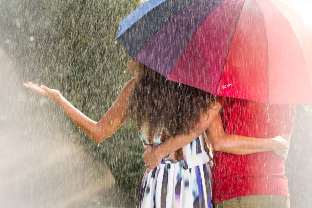 istock Man and woman under umbrella 657361446