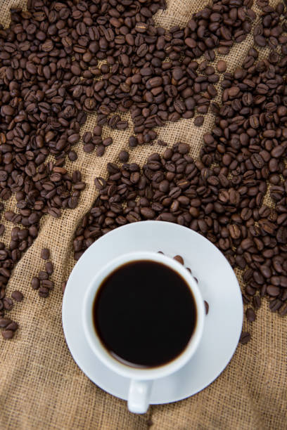 istock Black coffee and coffee beans on sack 657362958