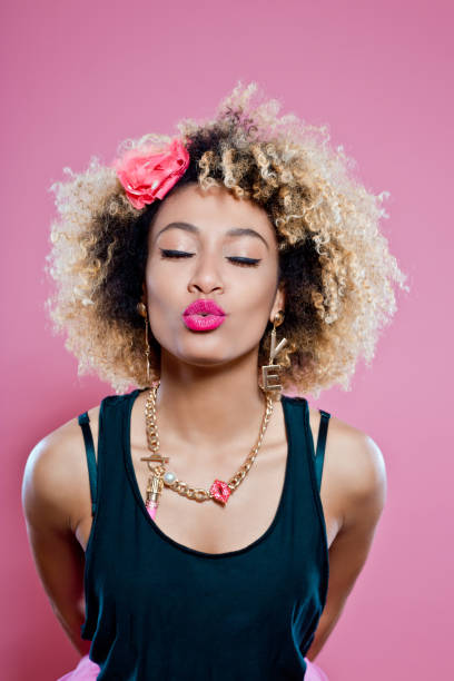 istock Cute afro woman sending kiss 657367010