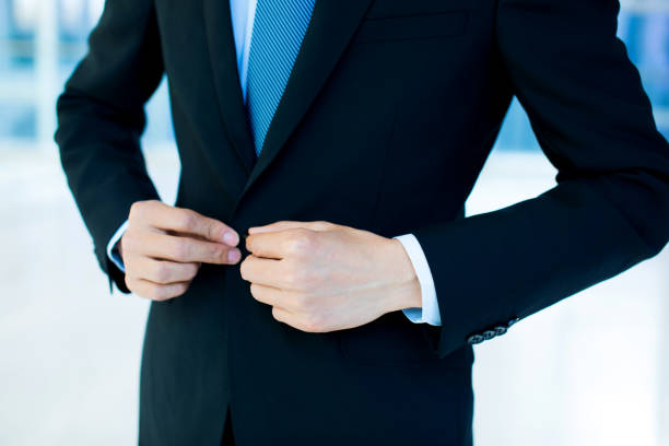 istock Close-up of of businessman buttoning jacket 657368314