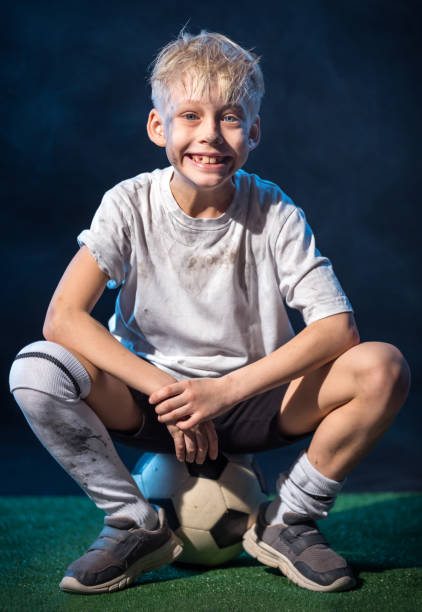 istock Portrait. Cheerful Boy Football Player 657372572