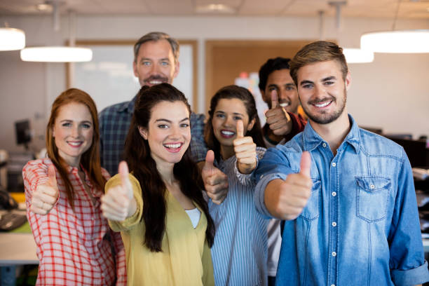 istock Creative business team showing thumbs up at office 657378014