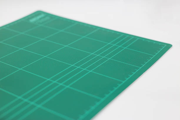 istock Close up green cutting mat with white background 657378344