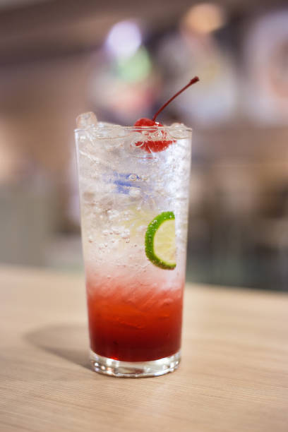 istock Closeup lemonade with fresh lemon and Cherry on wooden table 657378790