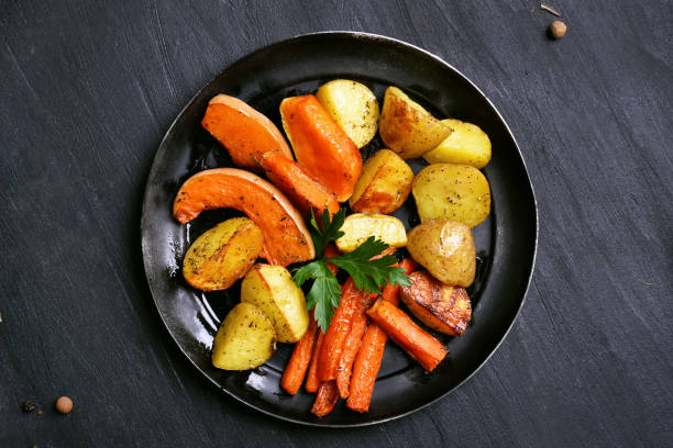 istock Baked pumpkin, potato, carrot in frying pan 657381846