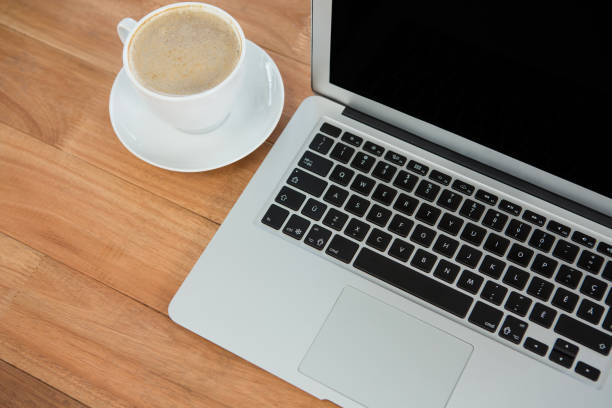 istock Cup of coffee and laptop 657381954