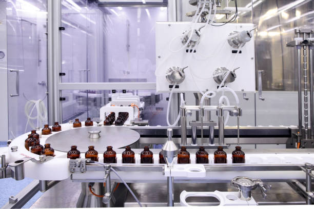 Sterile capsules for injection. Bottles on the bottling line of the pharmaceutical plant. Machine after checking sterile liquids. Interferon, nasoferon. Sterile bottles and ampoules on the dispensing line. Sealed ampoules with medicine. pharmaceutical factory stock pictures, royalty-free photos & images