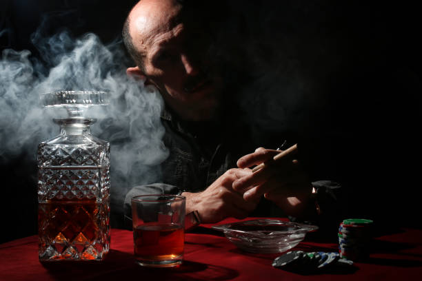 istock man smoke pipe and play poker 657382496