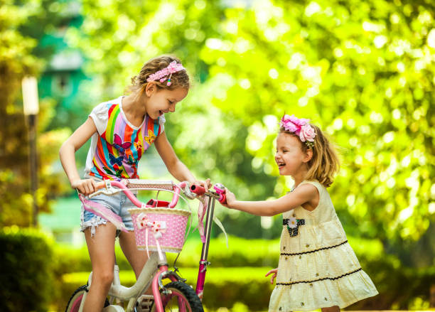 Happy Girls Riding Bikes