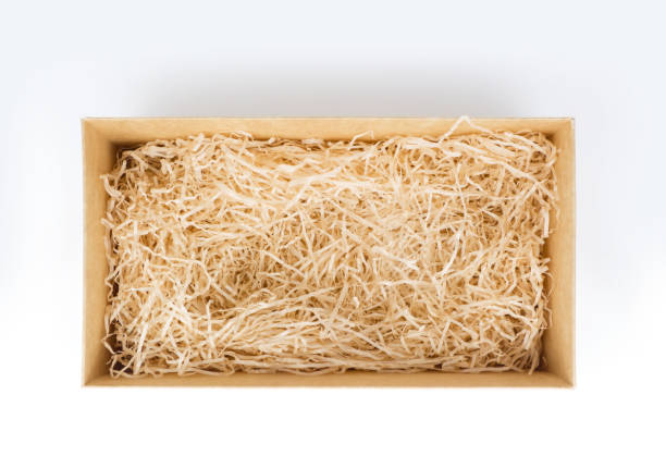 open gift box with decorative straw, top view - shavings imagens e fotografias de stock