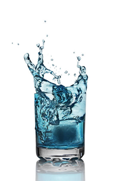 istock Splash in glass of blue alcoholic cocktail drink with ice cube 657389044