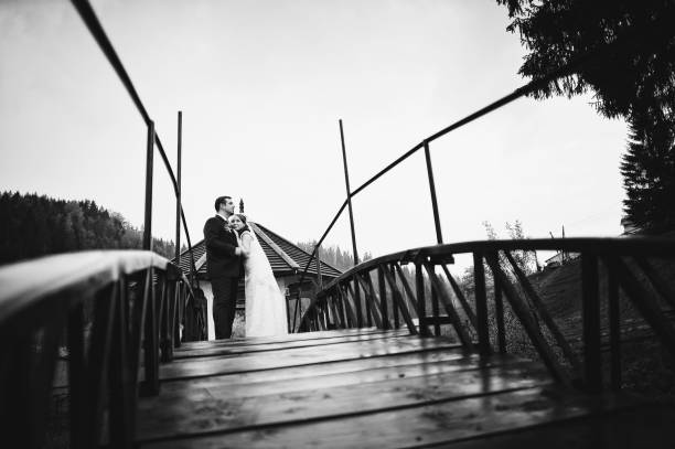 istock wedding couple at the small bridge 657392208