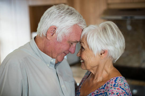 istock Happy senior couple looking at each other in kitchen 657396800