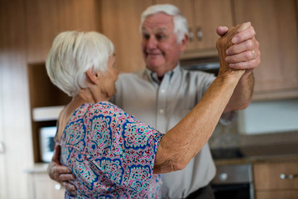 istock Senior couple dancing together in kitchen 657396978