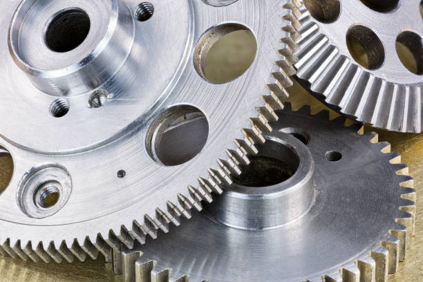istock grey metal gear cogwheels on scratched industrial background macro 657400028