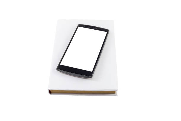 istock Phone and book. New versus old concept. 657400090
