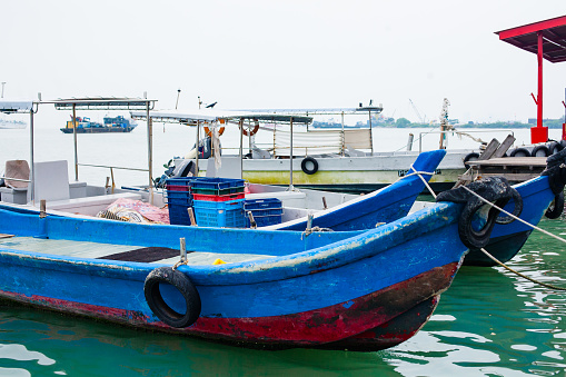 Penang island Malaysia. \nBoats near Malaysia tropic beach. Fish industry. Beautiful seascape