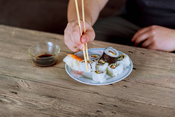 istock Traditional Japanese cuisine, sushi rolls on a view from the top 657407450
