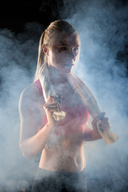 istock sporty woman with towel 657411216
