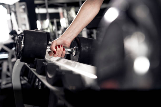 istock Gym fitness workout: Woman ready to exercise with dumbbell 657417746